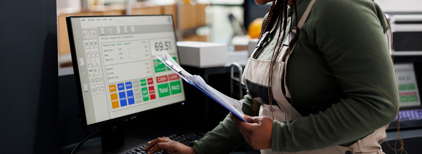 How to Track Inventory Effectively with Your Bookkeeping System woman using computer tracking inventory