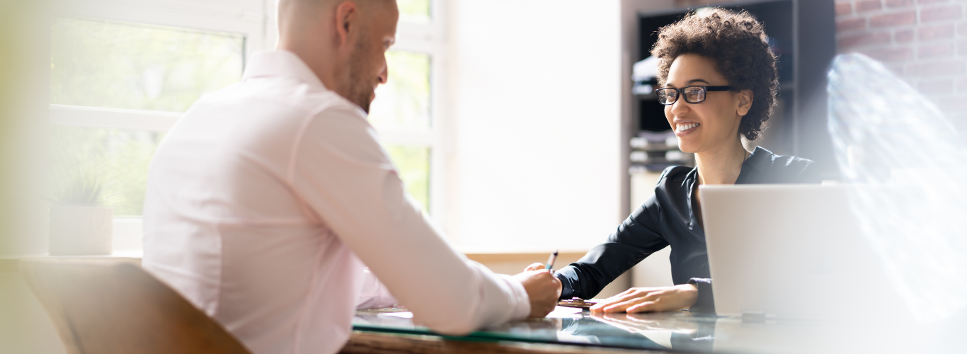 How Business Owners Can Strategize for Future Financial Planning a man and woman sitting at a desk