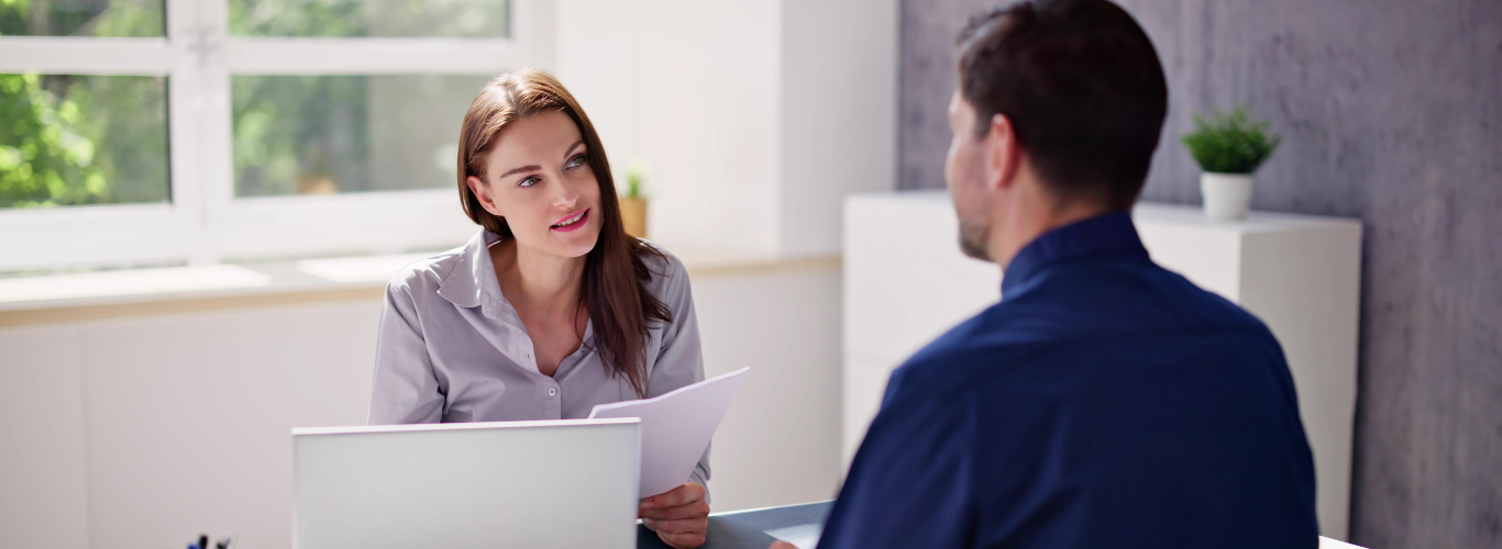 Difference Between a Bookkeeper and an Accountant Woman Man Sitting Desk Aq2B3bRk90iz40w9